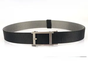 Close-up of metal automatic buckle with quick release on two-tone nylon canvas belt