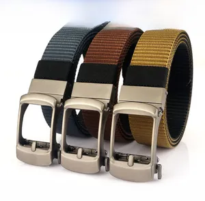 Detail of three nylon belts in grey, brown, and khaki with alloy rotating buckles