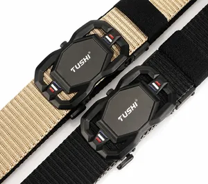 Detail of matte black buckle and textured nylon weave on khaki and black belts