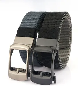 Detail of gray and black nylon belts with metal automatic buckles and woven texture