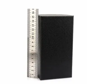 Detail view of black rectangular belt gift box made of textured paper showing 15cm length