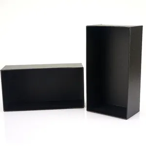 Macro view of matte black rectangular gift boxes showing texture and internal depth