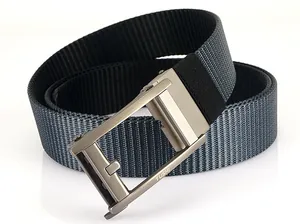 Close-up of TUSHI nylon belt showing grey striped texture and matte metal auto buckle