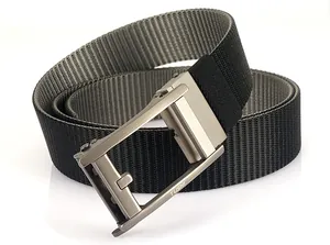 Macro detail of men's nylon web belt featuring a brushed gunmetal automatic slide buckle
