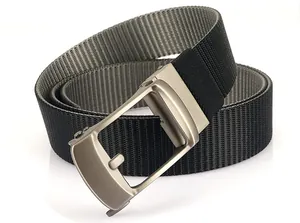 Close-up of dual-color nylon belt with matte metal automatic buckle and woven texture