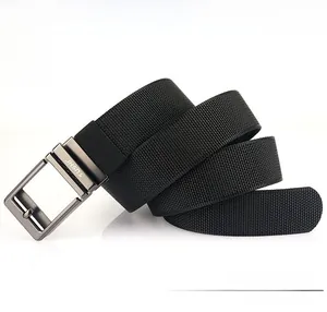 Detail shot of the thick nylon web strap and the grey metal buckle with TUSHI logo