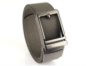 Close-up of tactical nylon web belt with brushed alloy buckle and engraved logo detail