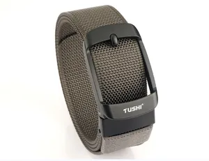 Detail of army green nylon belt with matte black buckle showing woven texture and pin buckle