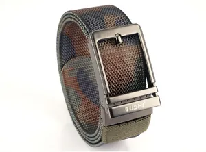 Detail of camouflaged nylon belt with dark gray alloy needle buckle and engraved TUSHI logo