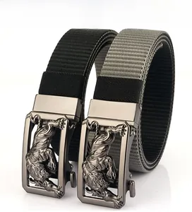 Detailed macro view of heavy-duty alloy buckle with embossed tiger on nylon belt