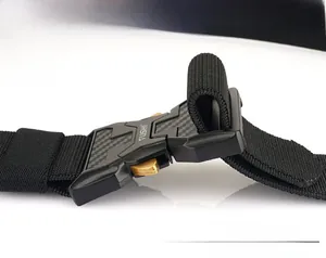 Macro shot of tactical nylon belt buckle with carbon fiber texture and quick release