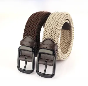 Close-up of flexible braided elastic belts with zinc alloy buckle and leather ends