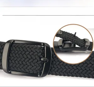 Macro detail of black braided elastic belt featuring a matte metal pin buckle design
