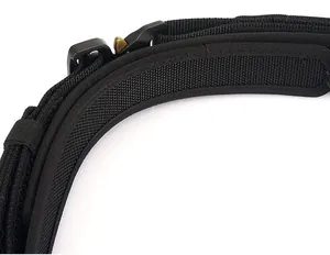 Detailed close-up of a black tactical nylon belt featuring a quick-release metal buckle system