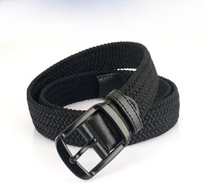 Detail of black woven elastic belt with matte metal buckle and textured silk blend fabric