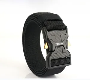 Detail of black nylon tactical belt with metal quick-release buckle and carbon fiber texture