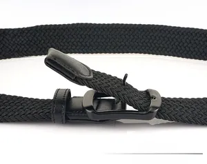 Close-up of black braided elastic belt showing pin buckle through woven gaps for adjustment