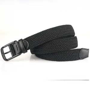 Detail of black woven belt with microfiber leather end and metallic pin buckle