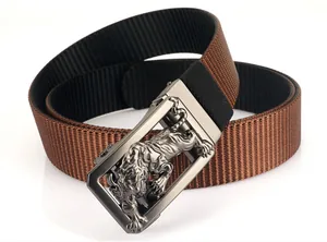Detail of 3D tiger relief on zinc alloy buckle with nylon belt texture close-up