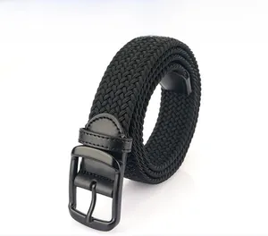 Detail of black woven elastic belt with matte metal buckle and reinforced leather ends