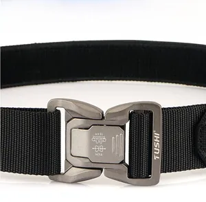 Close-up of quick-release alloy buckle with engraved logo on black tactical belt
