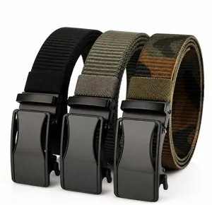 Close-up of black, army green and camouflage nylon belts with matte automatic buckles