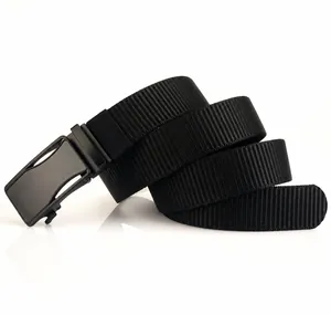 Detail view of thick black nylon belt strap with matte automatic metal buckle