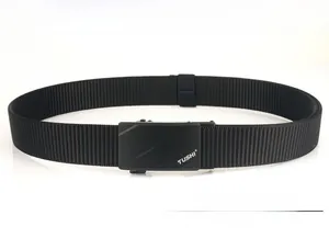 Macro view of matte black metal automatic buckle and nylon tactical belt texture