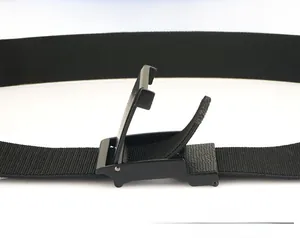 Detail of adjustable black nylon canvas belt with a matte black smooth buckle