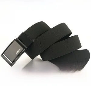 Close-up of TUSHI elastic polyester web belt with matte metal buckle and logo