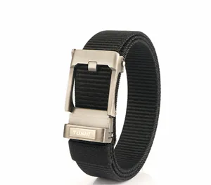 Detail of matte metal buckle with brushed finish on a black nylon woven tactical belt