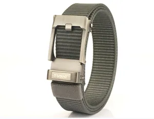 Detailed macro view of olive green nylon tactical belt with matte silver automatic buckle