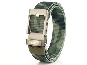Macro detail of camouflage nylon webbing and brushed metal automatic buckle