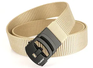 Detail of khaki nylon tactical belt with black automatic buckle featuring TUSHI logo