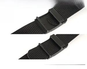 Detail of black nylon tactical belt featuring a durable plastic adjustable buckle system
