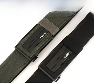 Detail of army green and black woven nylon belts with matte black automatic buckles