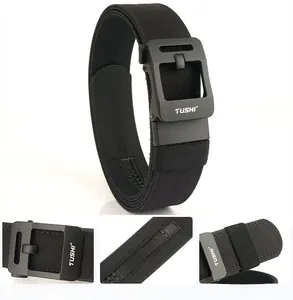 Macro shot of tactical nylon belt showing matte buckle with TUSHI logo and inner teeth