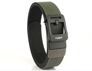 Close-up of military green tactical nylon belt with matte black TUSHI automatic buckle