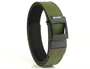 Detail showing tactical nylon belt buckle with TUSHI logo and durable woven texture