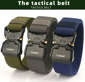 Close-up of tactical nylon belts in green, grey, and blue with metal release buckles