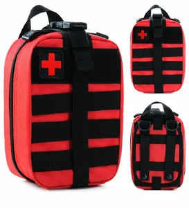 Detail view of red tactical medical bag featuring MOLLE system straps and cross patch