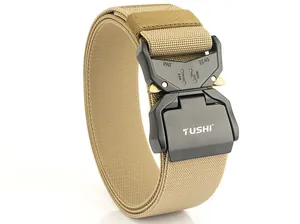 Close-up of quick-release metal buckle with laser-etched specs on khaki tactical belt