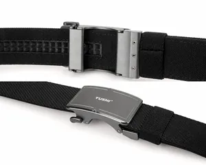 Detail of matte alloy buckle with TUSHI logo and adjustable nylon webbing texture