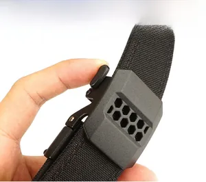 Detail of tactical nylon belt showing quick-release buckle and one-handed operation