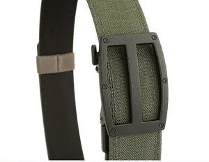 Detail of olive green tactical nylon belt showing the matte black buckle and fabric texture
