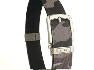 Macro detail of military camouflage nylon webbing and polished silver metal buckle