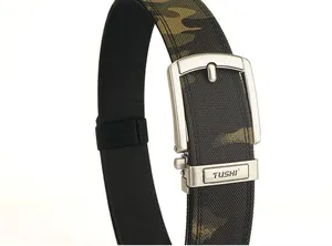 Detail of tactical nylon belt buckle with camouflage webbing and metallic TUSHI logo