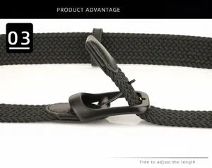 Detailed close-up of a black elastic woven belt with a matte metal pin buckle