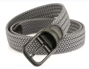 Macro shot of dark grey elastic braided belt with matte black metal buckle detail