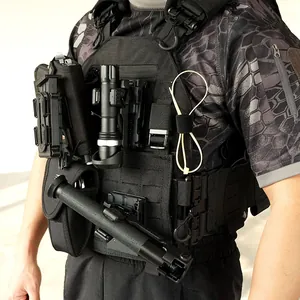 Tactical 1000D MOLLE plate carrier with flashlight and pouches on military camo shirt